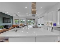 Bright kitchen with a large island and stainless steel range hood and appliances, perfect for cooking and entertaining at 187 E Santa Lucia Ln, Queen Creek, AZ 85140