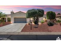 Charming single-story home featuring a two-car garage and mature landscaping at 23108 N Pedregosa Dr, Sun City West, AZ 85375