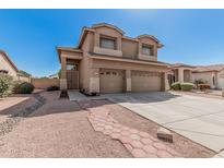 Charming two-story home featuring a three-car garage and beautiful desert landscaping at 3875 E Juanita Ave, Gilbert, AZ 85234