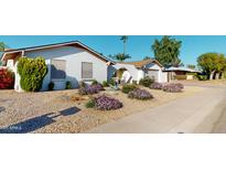 Charming single-story home with desert landscaping and a covered entryway offering curb appeal at 4014 W Anderson Dr, Glendale, AZ 85308