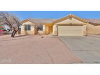 Charming single-story home with a two-car garage and desert landscaping at 516 N Emery --, Mesa, AZ 85207