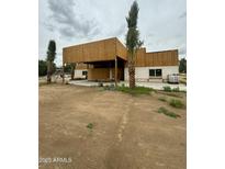 Exterior view of property under construction with palm trees and concrete slab at 5550 E Shea Blvd, Scottsdale, AZ 85254