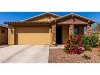 Inviting single-story home featuring a two-car garage and well-maintained landscaping at 5712 S Parkwood --, Mesa, AZ 85212