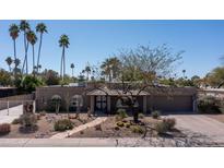 Charming single-story home with desert landscaping and a welcoming tiled front entry at 6529 E Voltaire Ave, Scottsdale, AZ 85254
