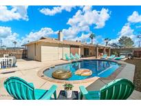 Backyard pool area featuring a refreshing pool, lounge chairs, and patio furniture for outdoor relaxation at 8209 E Heatherbrae Ave, Scottsdale, AZ 85251