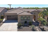 Charming home with a tile roof, desert landscaping, and a two-car garage at 12439 W Yellow Bird Ln, Peoria, AZ 85383