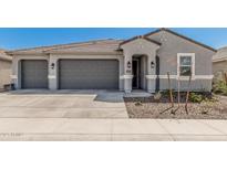 Charming single-Gathering home featuring a three-car garage and a modern architectural design at 2475 W Spaulding Ave, Apache Junction, AZ 85120