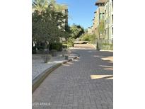 Sidewalk showcasing desert landscaping and the residential building architecture at 5450 E Deer Valley Dr # 2023, Phoenix, AZ 85054