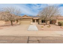 Charming single-story home boasts a tile roof, desert landscaping, and solar panels for energy efficiency at 760 W Douglas Ave, Gilbert, AZ 85233