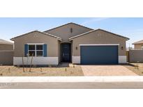 Charming single-story home featuring a 2-car garage and desert landscaping at 17621 W Pierson St, Goodyear, AZ 85395