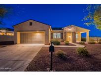 Charming single-story home featuring a stone-accented entrance and a well-manicured front yard at 21913 N Pedregosa Ct, Sun City West, AZ 85375