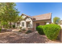 Charming single-story home with well-maintained landscaping and a welcoming entryway at 2580 E Boston St, Gilbert, AZ 85295