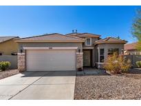 Charming single-Gathering home featuring a neutral palette, tile roof, and a two-car garage at 45105 W Gavilan Dr, Maricopa, AZ 85139