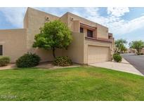 Charming home featuring a well-manicured lawn and an attached two-car garage at 8873 N 47Th Ln, Glendale, AZ 85302