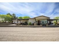 Spacious single-story home with a gravel front yard, covered porch, and desert landscaping for great curb appeal at 15218 E San Tan Blvd, Gilbert, AZ 85298