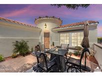 Inviting outdoor patio area with comfortable seating, perfect for relaxing and entertaining at 12860 W Junipero Dr, Sun City West, AZ 85375