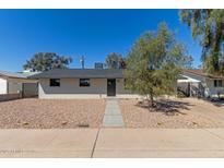 Charming single-story home with desert landscaping, rock cover, and a well-maintained front yard at 1646 W Fairmont Dr, Tempe, AZ 85282
