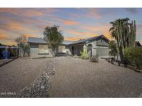 Inviting home with well-kept landscaping, decorative rocks and a charming front entrance at 3325 N Desoto St, Chandler, AZ 85224