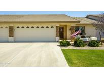 Charming single-story home with a spacious three car garage and welcoming front porch at 11250 E Kilarea E Ave # 277, Mesa, AZ 85209