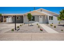 Charming home featuring a covered carport and freshly landscaped front yard at 2634 N 52Nd Ave, Phoenix, AZ 85035