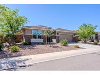 Beautiful single-story home featuring desert landscaping and a two-car garage at 4557 W South Butte Rd, San Tan Valley, AZ 85144