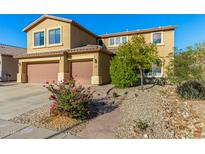 Two story home featuring an attached two car garage, landscaped yard and walkway leading to the front door at 6506 W Bent Tree Dr, Phoenix, AZ 85083