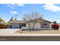 Charming single-story home with a well-manicured front yard and inviting curb appeal at 8201 E Piccadilly Rd, Scottsdale, AZ 85251