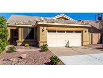 Charming single-story home with a two-car garage and low maintenance desert landscaping in front at 1552 E Shannon St, Chandler, AZ 85225