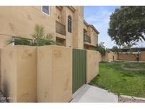 Charming stucco townhome with a private gated courtyard and second story balcony at 5015 E Cheyenne Dr # 10, Phoenix, AZ 85044