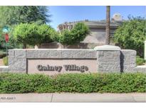 Gainey Village entrance sign with lush landscaping shows community pride and upscale neighborhood appeal at 7318 E Woodsage Ln, Scottsdale, AZ 85258