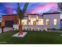 Modern home boasts striking architecture, lush landscaping, and inviting curb appeal at 7325 E Virginia Ave, Scottsdale, AZ 85257