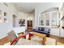 Bright living room with high ceilings, hardwood floors, and a view of the front entrance at 7705 E Doubletree Ranch Rd # 36, Scottsdale, AZ 85258
