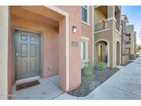 Inviting condo exterior with a private entrance, neutral tones, and well-maintained landscaping at 900 S 94Th St # 1204, Chandler, AZ 85224