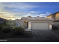 Charming single-story home with a well-manicured front yard and a two-car garage at 10160 E Conieson Rd, Scottsdale, AZ 85260