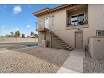 Exterior view of a two-story apartment building with private balconies, stairs, and desert landscaping at 17010 E Calle Del Oro -- # D, Fountain Hills, AZ 85268