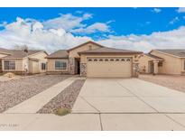 Charming single-story home featuring a two-car garage and low-maintenance desert landscaping at 1775 E Sycamore Rd, Casa Grande, AZ 85122