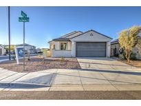 Charming single-story home featuring a two-car garage and low-maintenance desert landscaping at 20162 W Buchanan St, Buckeye, AZ 85326