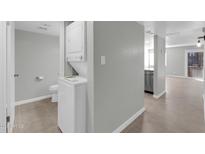 Bathroom and laundry room with washer and dryer next to stainless steel dishwasher at 604 E Weber Dr # 12, Tempe, AZ 85288