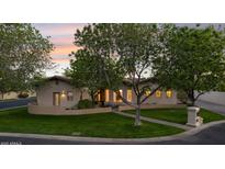 Charming home exterior featuring lush landscaping, a well-manicured lawn, and a welcoming entrance at 8336 S Homestead Ln, Tempe, AZ 85284