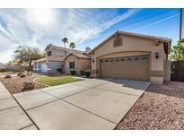 Charming single-Gathering home featuring a two-car garage and a well-maintained lawn with desert landscaping at 1569 E Princeton Ave, Gilbert, AZ 85234