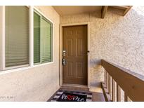 Inviting front entry with decorative door mat and secure smart lock at 520 N Stapley Dr # 286, Mesa, AZ 85203