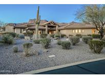 Stunning Southwestern home with desert landscaping and mountain views at 6545 E Ponderosa Loop, Gold Canyon, AZ 85118