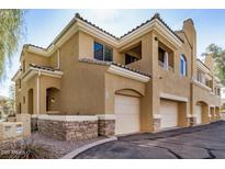 Two-story home featuring stucco siding, two car garages, and stone veneer accents for a luxurious aesthetic at 955 E Knox Rd # 224, Chandler, AZ 85225