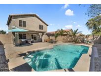 Outdoor living featuring a private pool, patio, and landscaped yard for relaxing and entertaining at 1061 E Poncho Ln, San Tan Valley, AZ 85143
