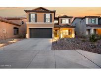 Beautiful two-story home featuring a spacious driveway and a well-maintained, xeriscaped front yard at 2435 W Via Dona Rd, Phoenix, AZ 85085