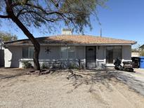 Charming single-story home with neutral gray stucco exterior, desert landscaping, and a secure front gate at 3018 W Rancho Dr, Phoenix, AZ 85017