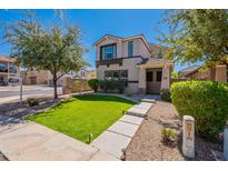 Beautiful two-story home with a manicured lawn and a charming entrance at 3507 E Jasper Dr, Gilbert, AZ 85296