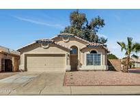 Charming single-story home features a well-maintained front yard and a two-car garage at 4804 W Topeka Dr, Glendale, AZ 85308