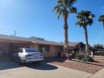 Charming single-story home features desert landscaping, a private drive, and a covered parking area at 5301 W Vernon Ave, Phoenix, AZ 85035