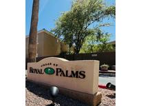 Community sign for Villas at Royal Palms features a tree and address number at 1335 E June St # 113, Mesa, AZ 85203